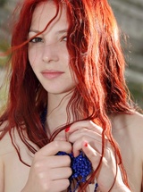 Redhead beauty Nalli A wearing only a necklace