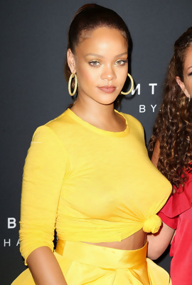 Rihanna in sexy yellow dress, showing big tits
