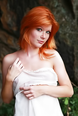 Sexy redhead amateur Mia Sollis nude in the forest