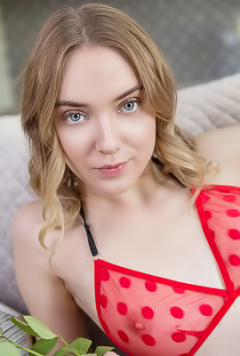 Oxana Chic Tantalizes In Lingerie On A Rose-adorned Couch Seductively Teasing Her Curves