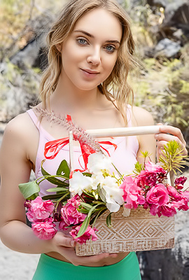 Oxana Chic Shows Off In Crop Top Gathering Flowers, Teasing View Under Shorts