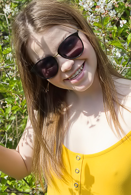 Julia Morozzi shows off perky nipples and barefoot in an outdoor garden striptease