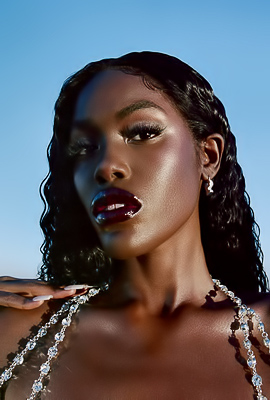 Tanerelle Commands Desert Heat as Beaded Hands Trace Every Curve